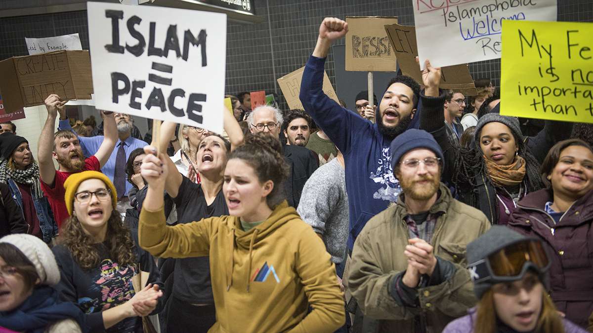 Protesters angered by President Donald Trump’s executive order that prevented refugees, visa and green card holders from entering the US chant pro-immigration slogans at Philadelphia International Airport. (Branden Eastwood for NewsWorks)