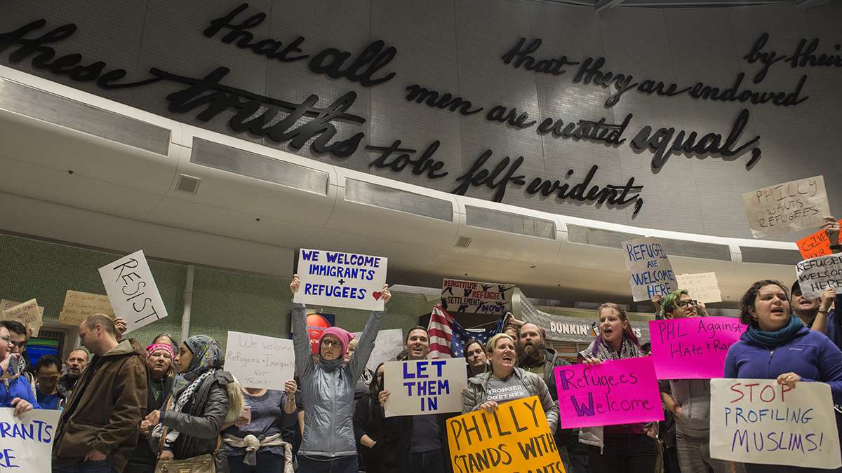 Protesters angered by President Donald Trump’s executive order that prevented refugees, visa and green card holders from entering the US chant pro-immigration slogans at Philadelphia International Airport. (Branden Eastwood for NewsWorks)
