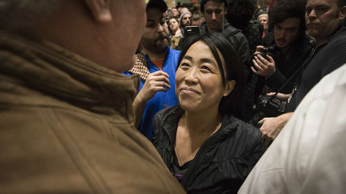 Councilwoman Helen Gym speaks at the Philadelphia International Airport. (Branden Eastwood for NewsWorks)
