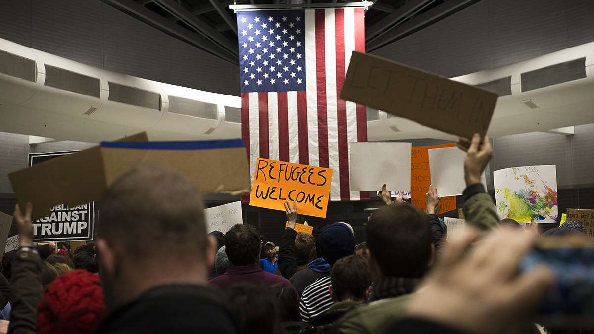 Protesters angered by President Donald Trump’s executive order that prevented refugees, visa and green card holders from entering the US chant pro-immigration slogans at Philadelphia International Airport. (Branden Eastwood for NewsWorks)