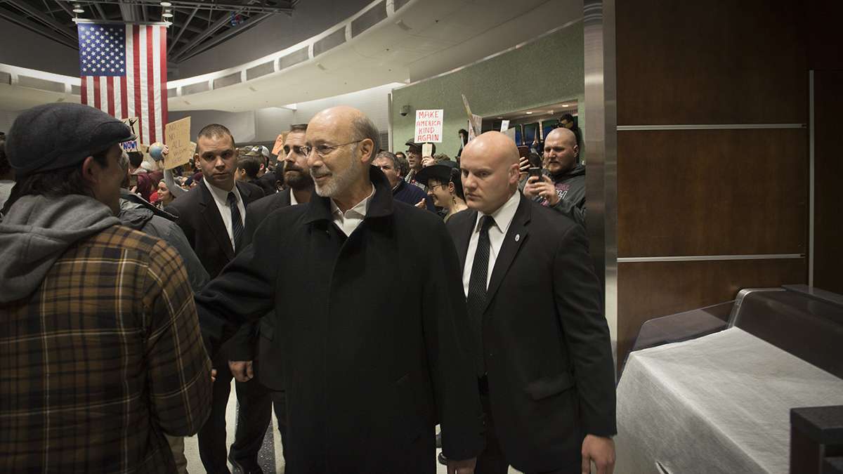 Pennsylvania Governor Tom Wolf leaves Philadelphia International Airport. (Branden Eastwood for NewsWorks)
