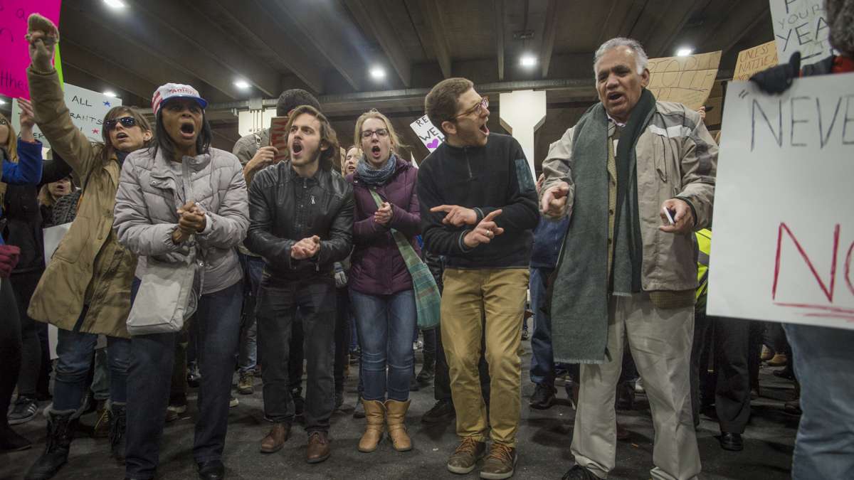 Protesters opposed to Donald Trump’s executive order on immigration march outside of Terminal A at Philadelphia International Airport. (Branden Eastwood for NewsWorks)