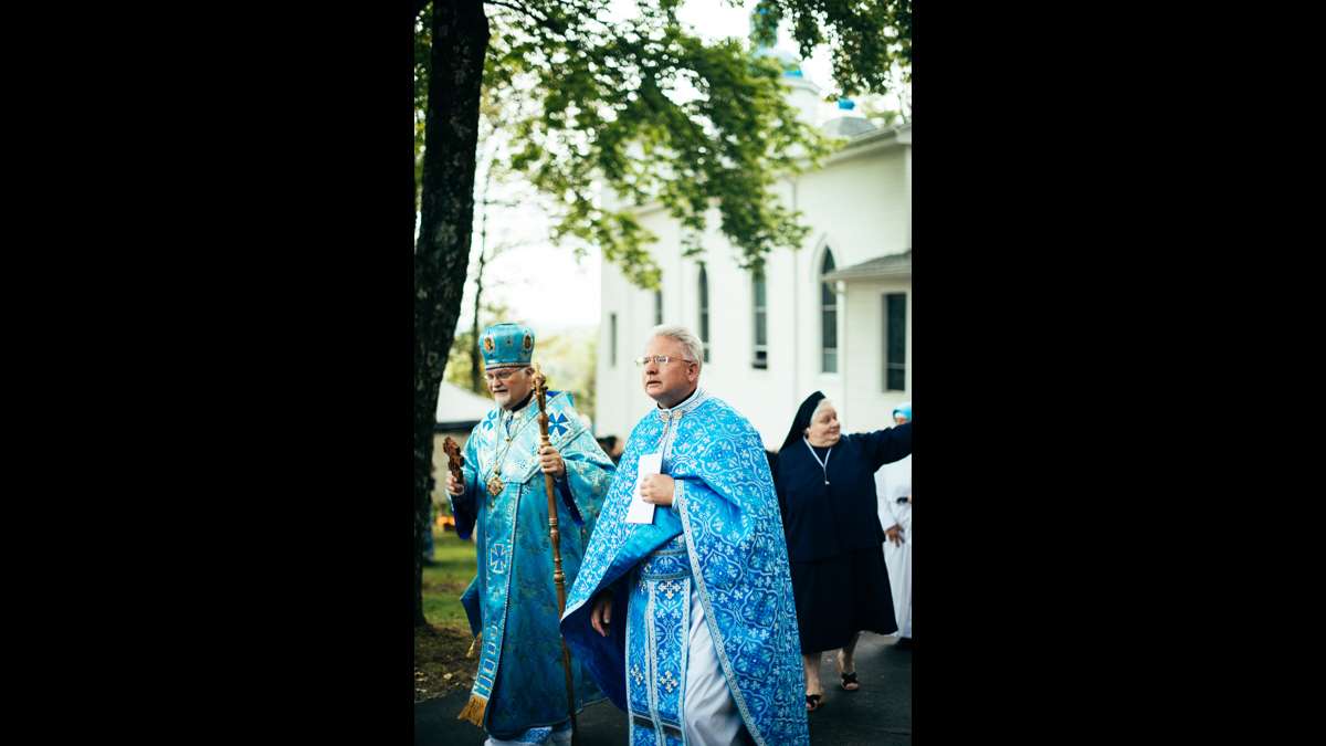 Metropolitan-Archbishop Stefan Soroka and Assumption of the Blessed Virgin Mary's pastor, Father Michael Hutsko, follow the procession of the replica of the Icon of Our Lady of Pochaiv.