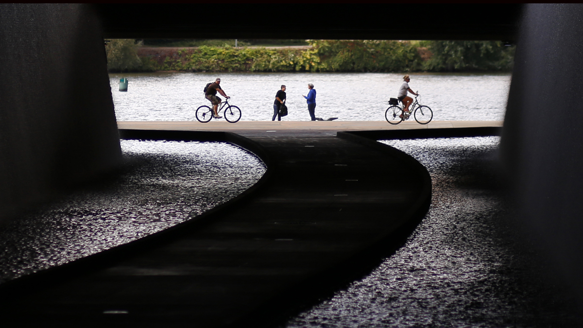  Cyclists ride along the Allegheny River in this view of a path in a tunnel under the David Lawrence Convention Center in downtown Pittsburgh. (AP Photo/Gene J. Puskar) 