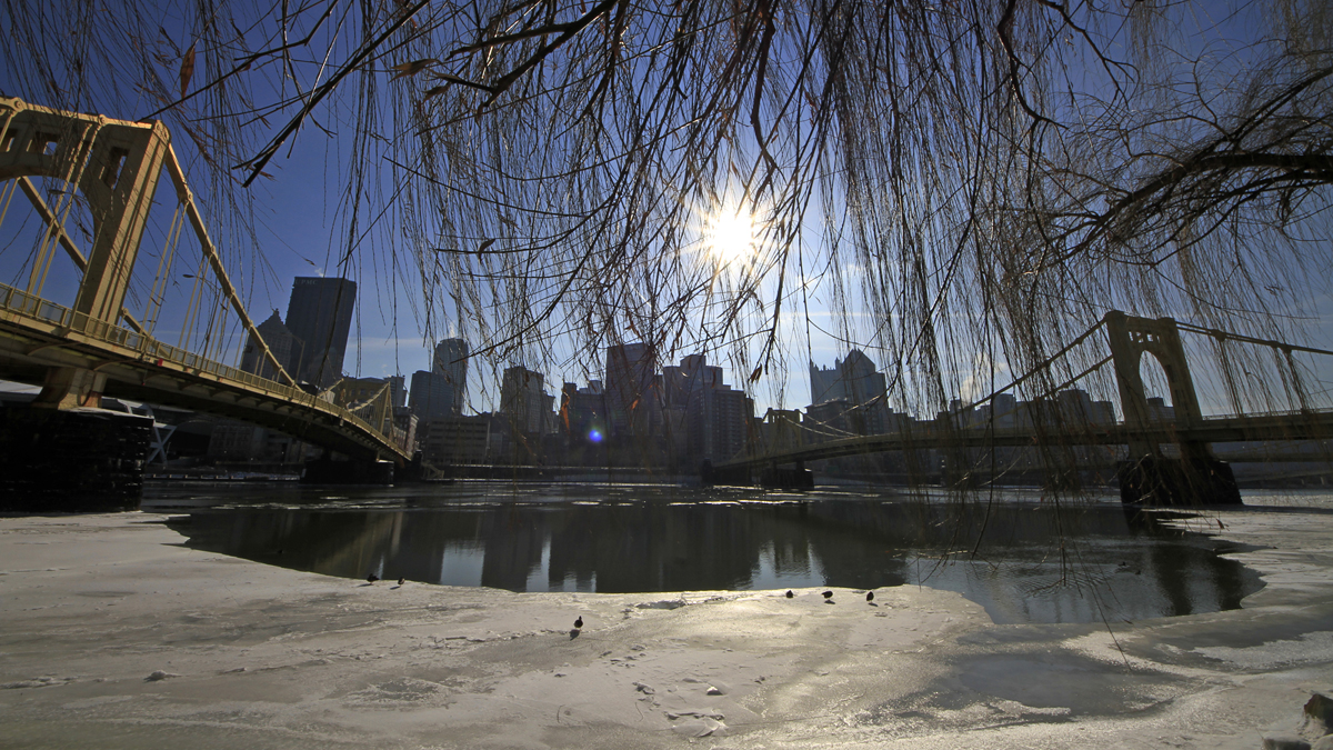  The sun hangs over the skyline of downtown Pittsburgh, beginning to melt ice on the Allegheny River. Pennsylvania cities, including Pittsburgh, ranked poorly on the Milken Institute's list of best performing metros. (AP Photo/Gene J. Puskar) 