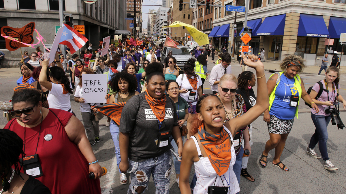 Marchers from 40 progressive groups from 30 states take part in the “Still We Rise” March in downtown Pittsburgh Friday