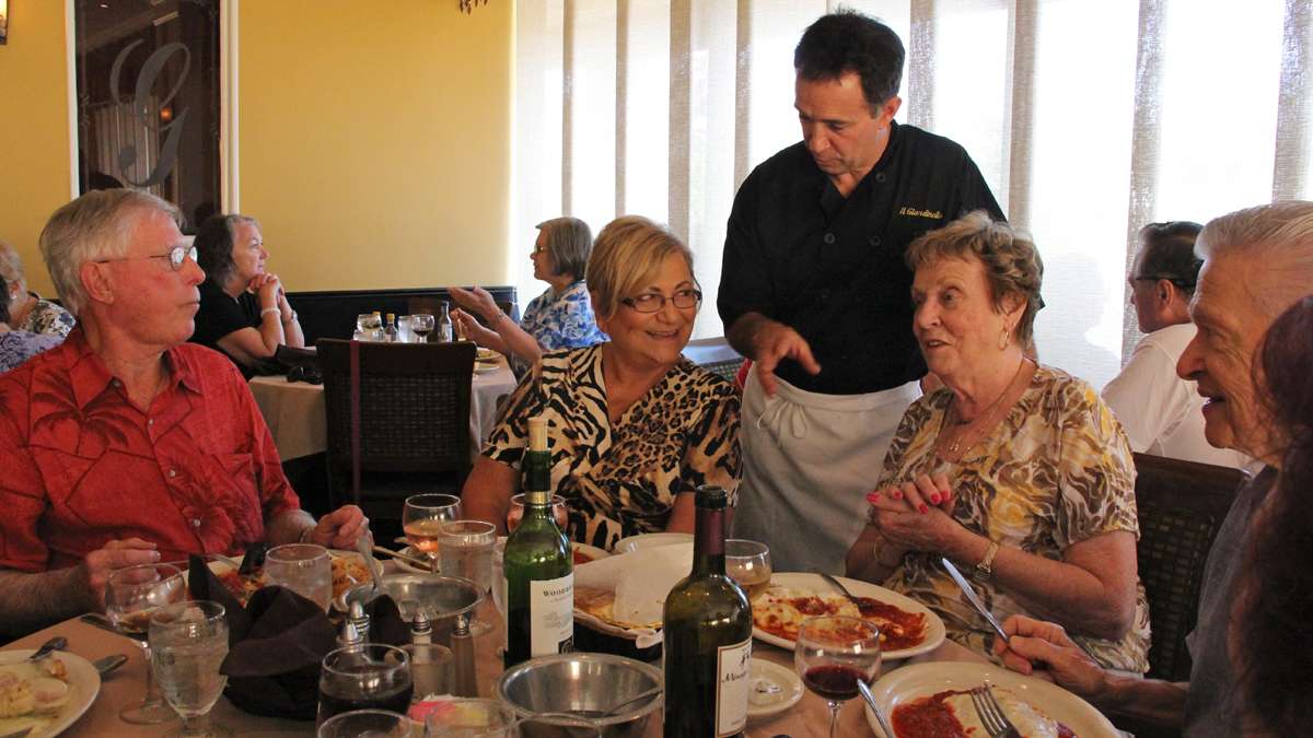 Il Giardinello Ristorante owner Joe Pisacreta mingles with customers at his Toms River restaurant. (Emma Lee/for NewsWorks)