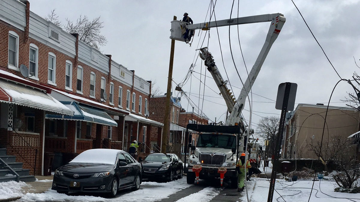  Delmarva Power crews work on downed power lines on Tulip St. in Wilmington on Wednesday. (John Jankowski/for NewsWorks) 