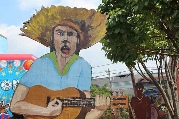 Paintings on plywood invited children to enter their own art and crafts garden  where staff from the Puerto Rican Workshop ( Taller Puertorriqueno)  and other Philadelphia cultural organizations worked with children to create masks, drawings and puppets.  (Elisabeth Perez-Luna)