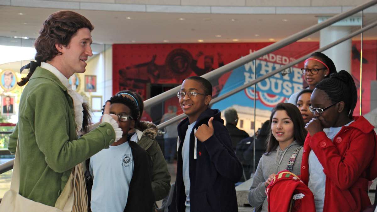 Thomas Jefferson portrayer Sean Connolly speaks with a group of youngsters at the National Constitution Center.