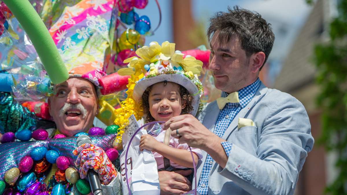 Winner of the boys' best-dressed, 2-to-5-year-old, contest, Marcus Henry, was held aloft to receive his prize.