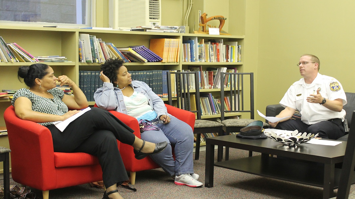  Lt. Dennis Rosenbaum talks safety with residents. (Matthew Grady/for NewsWorks) 