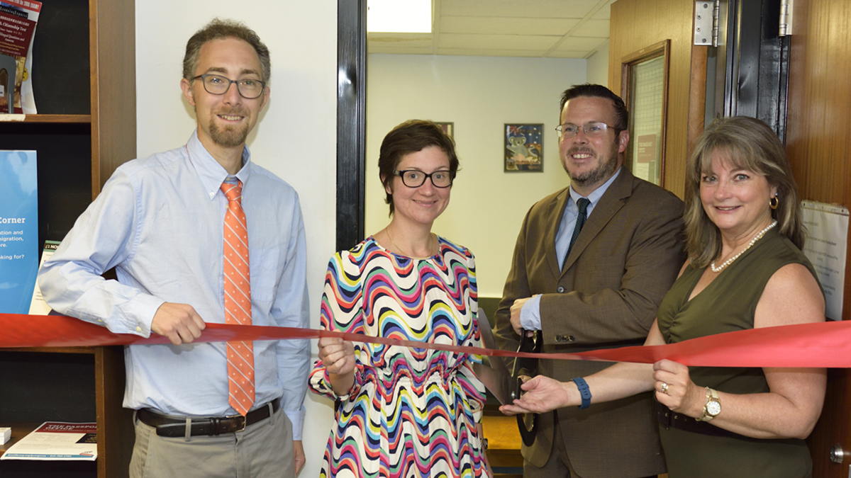  (From left) Regional Librarian Peter Lehu; Customer Service Manager Bridget Bielicki;State Representative Kevin J. Boyle; and Siobhan A. Reardon, President and Director of the Free Library of Philadelphia pose for a photo during the ribbon cutting ceremony of a new passport center in Northeast Philadelphia. (Photo by Jules Vuotto) 