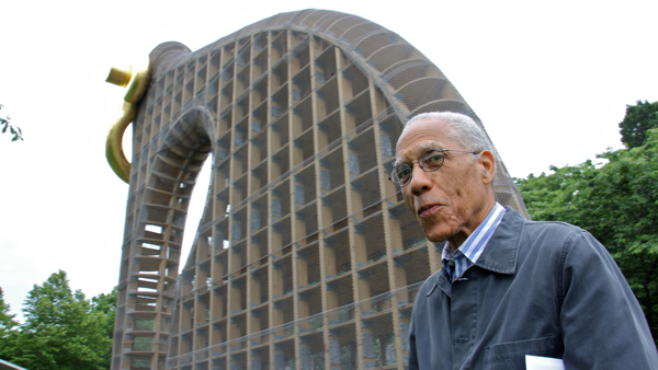  Visitors to the Print Center look at works by Martin Puryear, the artist who brought ''Big Bling'' to Fairmount Park this spring. Puryear's prints will be on exhibit through Nov. 18. (Peter Crimmins/WHYY) 