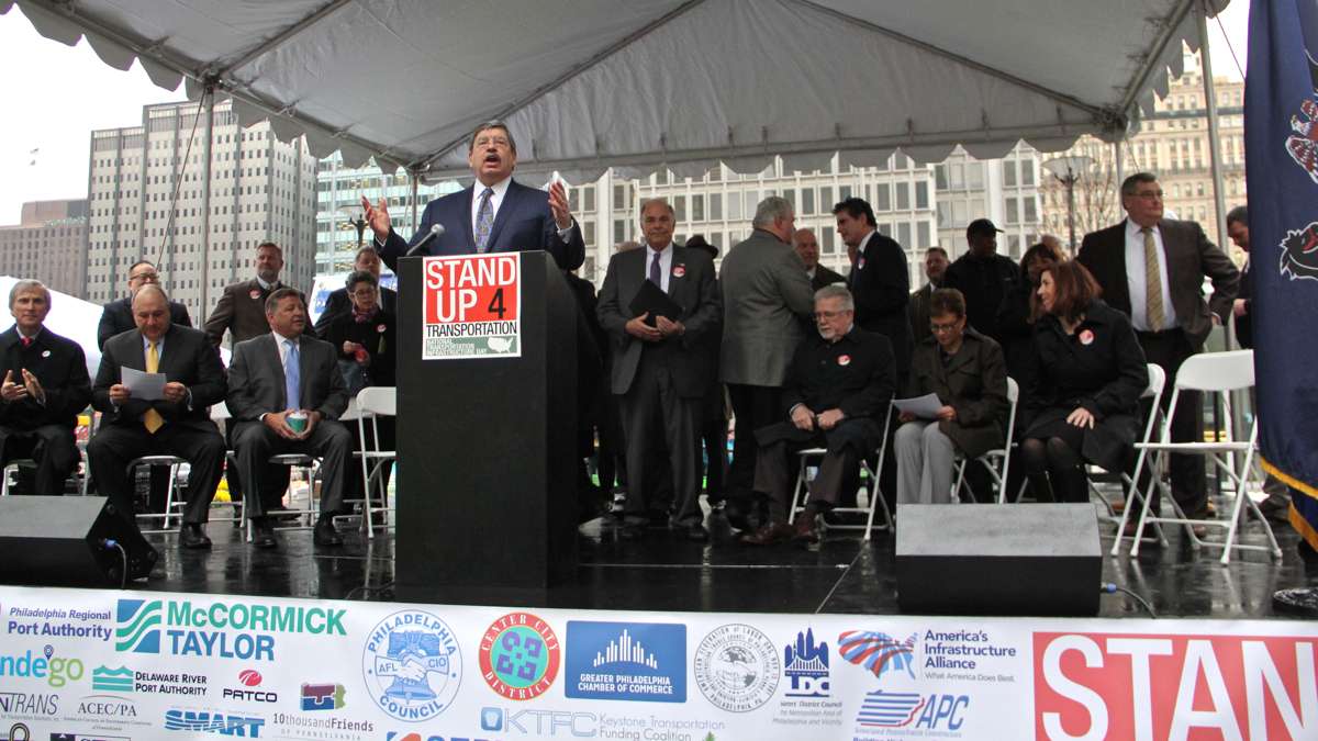 Government officials, politicians and labor leaders gather for a rally at Dilworth Park to demand federal funding for transportation infrastructure improvements. (Emma Lee/WHYY)
