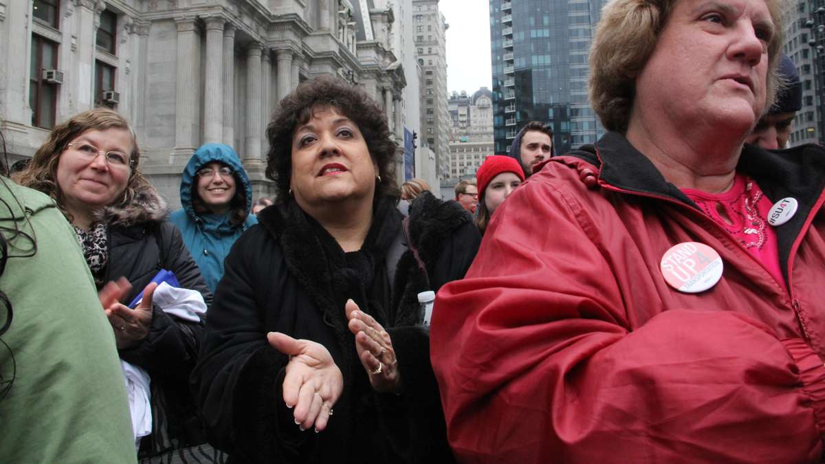 Stand Up 4 Transportation rally participants applaud speakers during the event at Dilworth Park. (Emma Lee/WHYY)