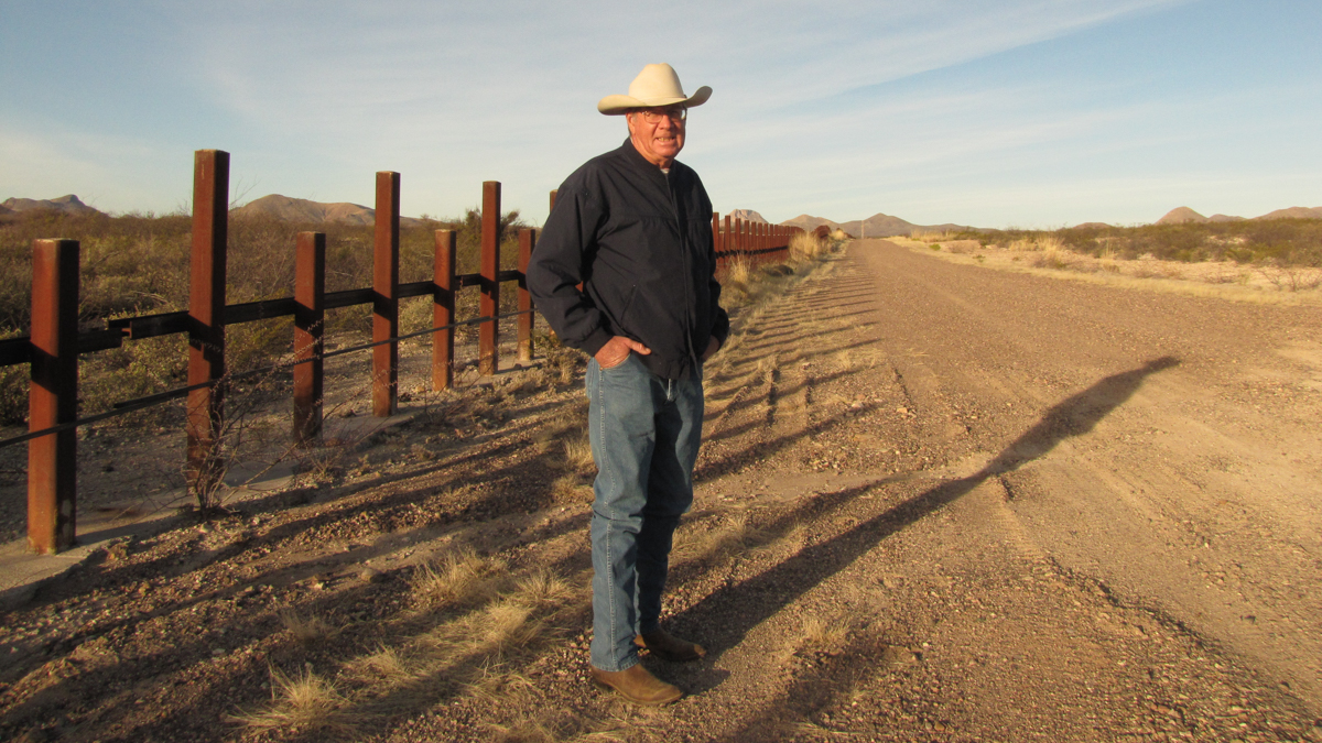  Bill McDonald, rancher conservationist and Executive Director of the Malpai Borderlands Group, stands at the U.S./Mexico border near Douglas, Arizona  (Maya Springhawk Robnett/for WHYY) 