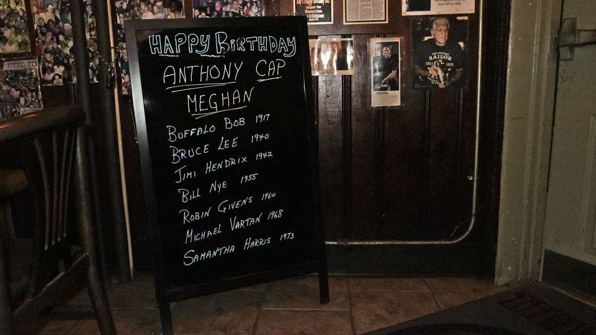 The happy-birthday sign at Ray's features the names and birthdays of regular customers and celebrities. (Kimberly Paynter/WHYY)