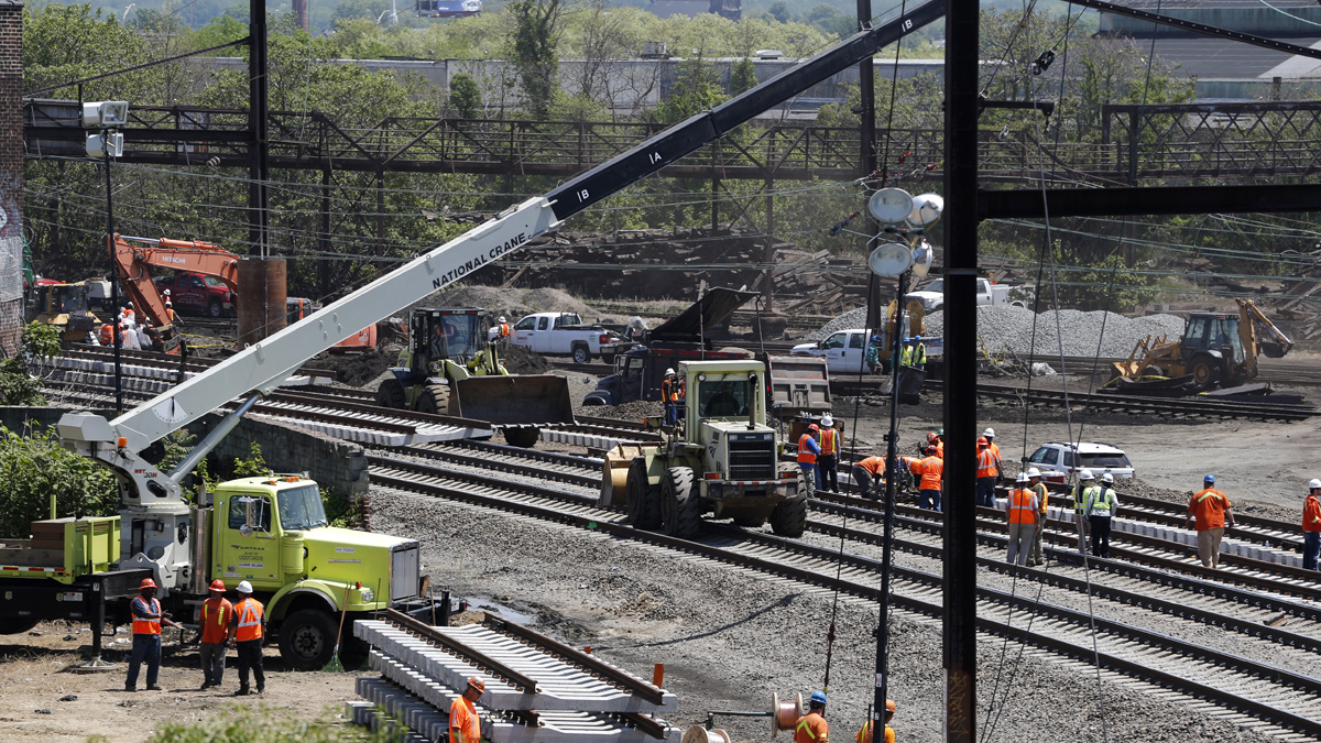  Amtrak is working to restore Northeast Corridor rail service between New York City and Philadelphia. Service was suspended after a train derailed Tuesday night, killing eight passengers. (AP Photo/Julio Cortez) 