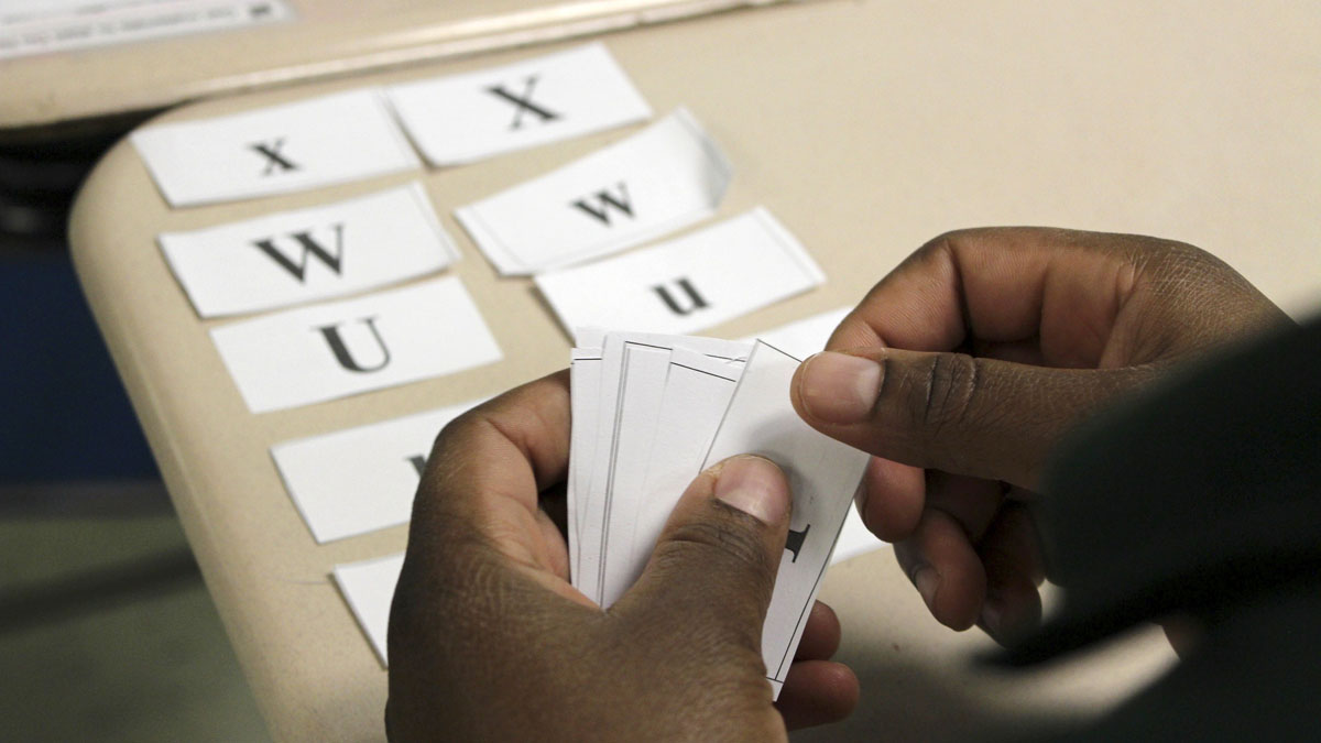  Harrisburg school officials ultimately admitted the two young children for whom they denied enrollment at first. But policy problems remain, advocates say. Last month, the ACLU finalized a consent decree with the School District of Lancaster after they found some older refugee students between 17 and 21 years old encountered obstacles in enrollment. In this photo, Shukuru Amanya works with paper letters in an English language class at Phoenix Academy in Lancaster, Pa. (AP Photo/Michael Rubinkam) 