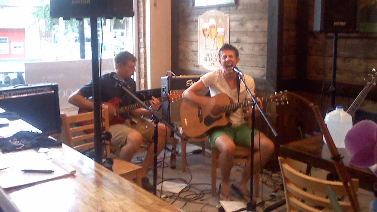  Give Me Gravity performs an acoustic number on Saturday night. (Carrie Hagen/for NewsWorks) 