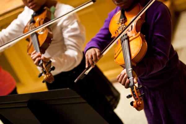 <p><p>Students in the Roxborough Cluster Festival's Combined Band and Orchestra play a rendition of "Don't Stop Believing'" by Journey. (Brad Larrison/For NewsWorks)</p></p>

