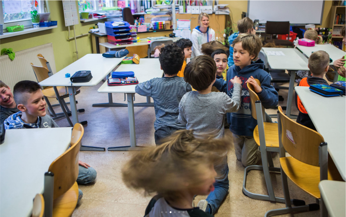 Students do a warm up exercise at Gustav Falke elementary school in the Wedding section of Berlin, Germany. (Jessica Kourkounis/For Keystone Crossroads)