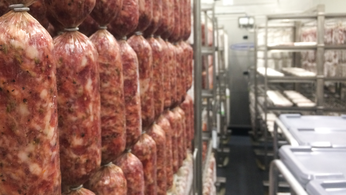 All the curing at New England Charcuterie is done in one large drying room. (Alan Yu/WHYY)