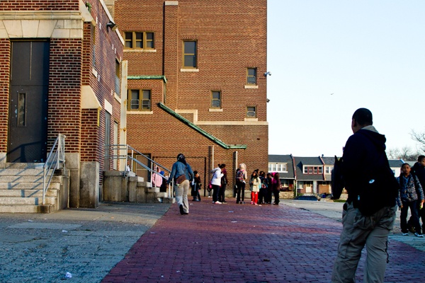 Students at John L. Kinsey Elementary in North Philadelphia make their way to school Thursday Morning. The school is one of many on a list of Philadelphia Public Schools that the district plans to close at the end of the school year. (Brad Larrison/for NewsWorks)