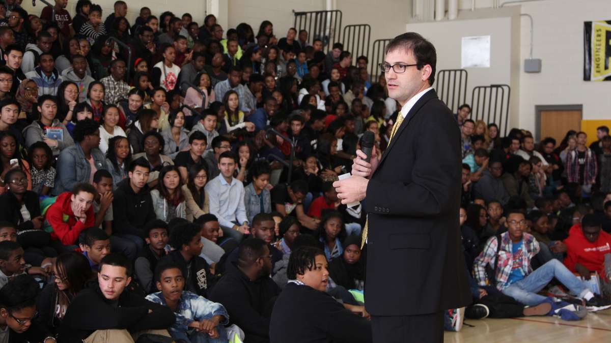 Carver High Principal Ted Domers congratulates students after the state's School Performance Profile ranked their school the second highest academic performer within the district. (Emma Lee/WHYY)