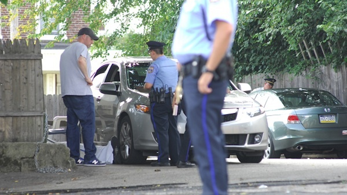 At the scene of a fatal shooting in West Oak Lane last summer. (Bas Slabbers for WHYY) 