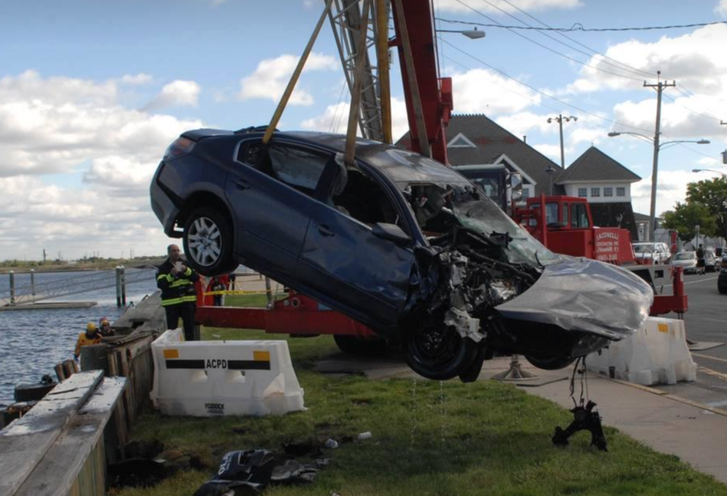  A crane moving a car back to land on Sunday after it was pulled from a bay in Atlantic City. ACPD photo.  