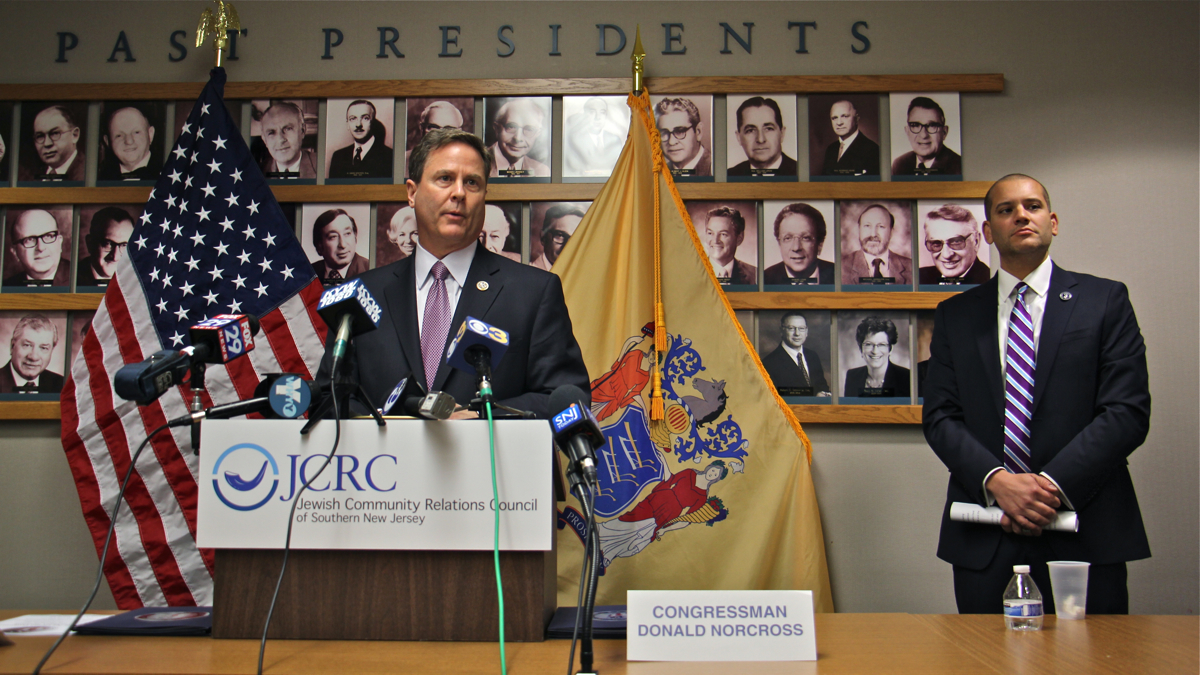  U.S. Rep. Donald Norcross (left) and New Jersey Office of Homeland Security and Preparedness Christopher Rodriguez announce $1 million in grants that will be made available to religious and community centers in South Jersey. The announcement was made at the Katz Jewish Community Center in Cherry Hill. (Emma Lee/WHYY) 