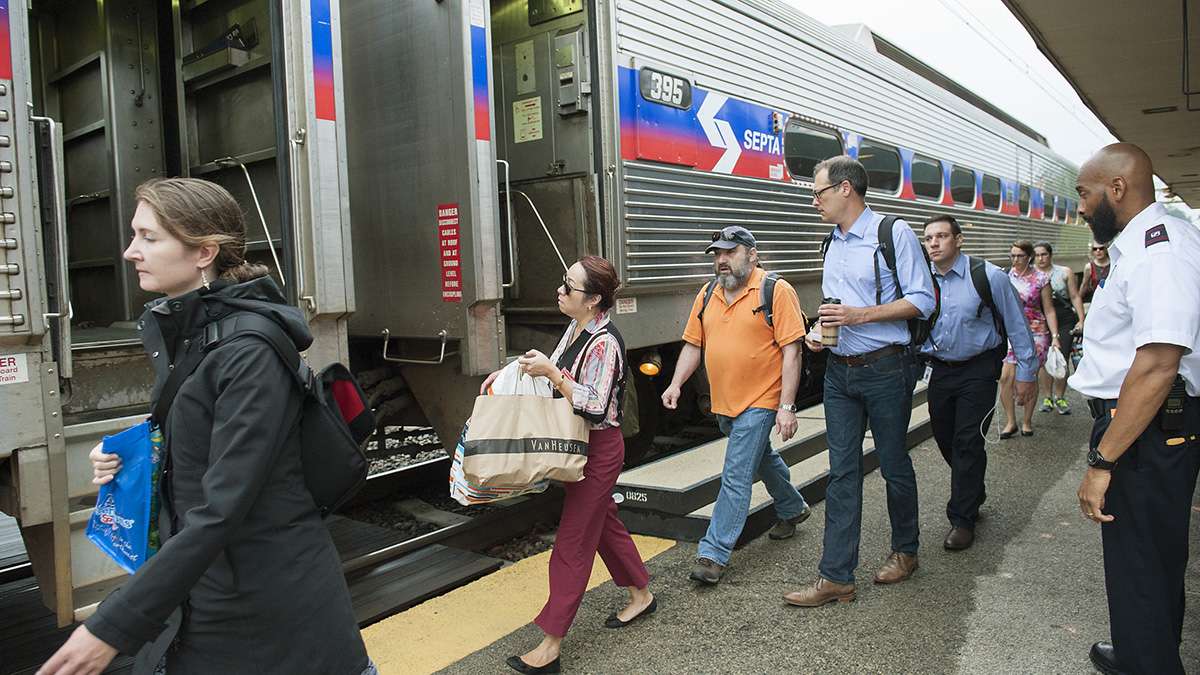 Passengers at the Ardmore Station board a SEPTA train to Philadelphia. (Jonathan Wilson for Newsworks)