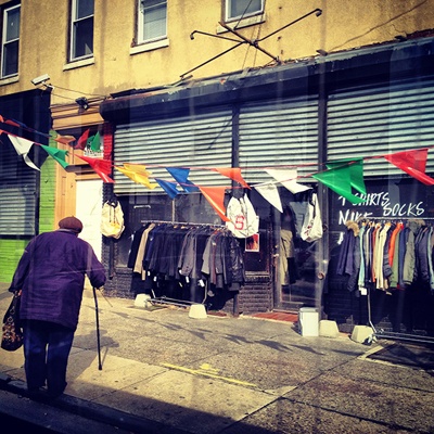 <p><p>Flags add some color to a clothing merchant's storefront in Southwest Philly. (Emma Fried-Cassorla/Philly Love Notes)</p></p>
