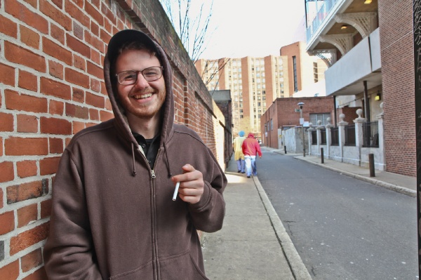 <p><p>Andrew Kornrunph works at the hospital coffee shop and takes smoke breaks in the alley across the street. He said that paying higher premiums on his health insurance is fine with him. (Kimberly Paynter/WHYY)</p></p>
