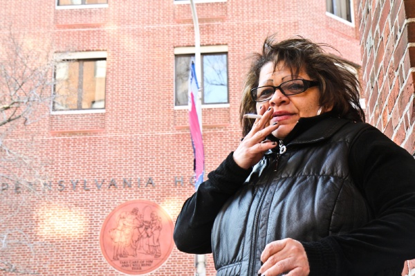 <p><p>Hospital tech Maribel Bembischew takes a smoke on her break outside Pennsylvania Hospital. (Kimberly Paynter/WHYY)</p></p>
