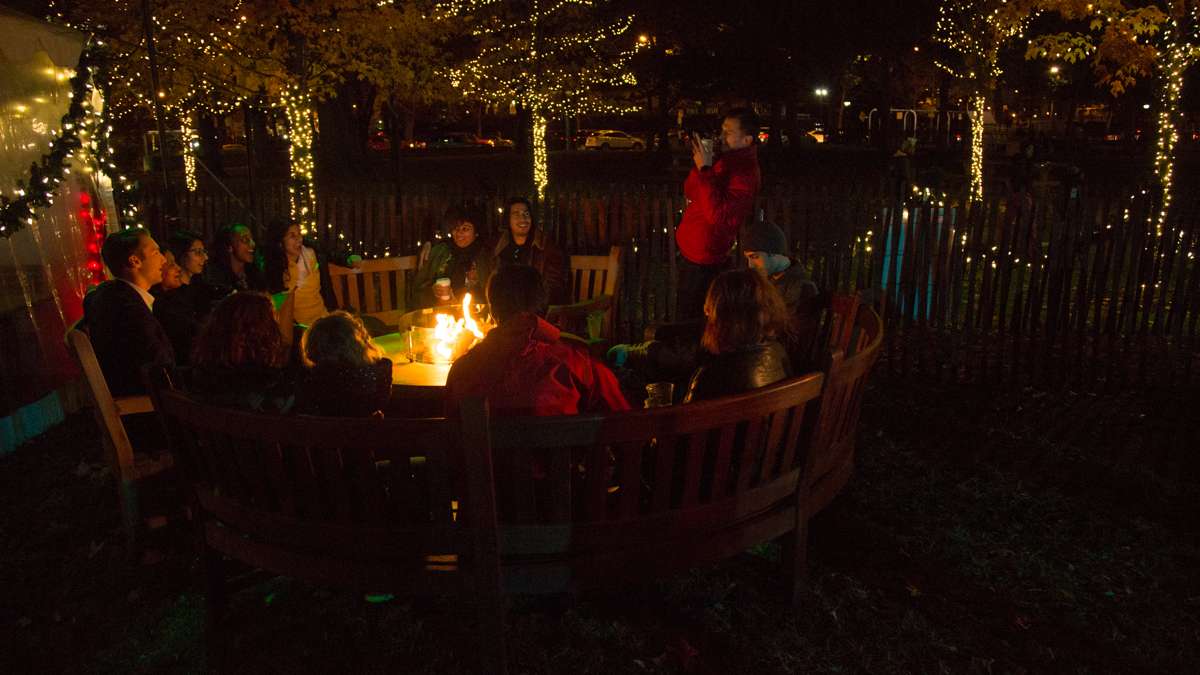 Fire pits dot the yard outside the beer garden providing ample warmth for revelers during The Franklin Square Holiday and Light Festival.