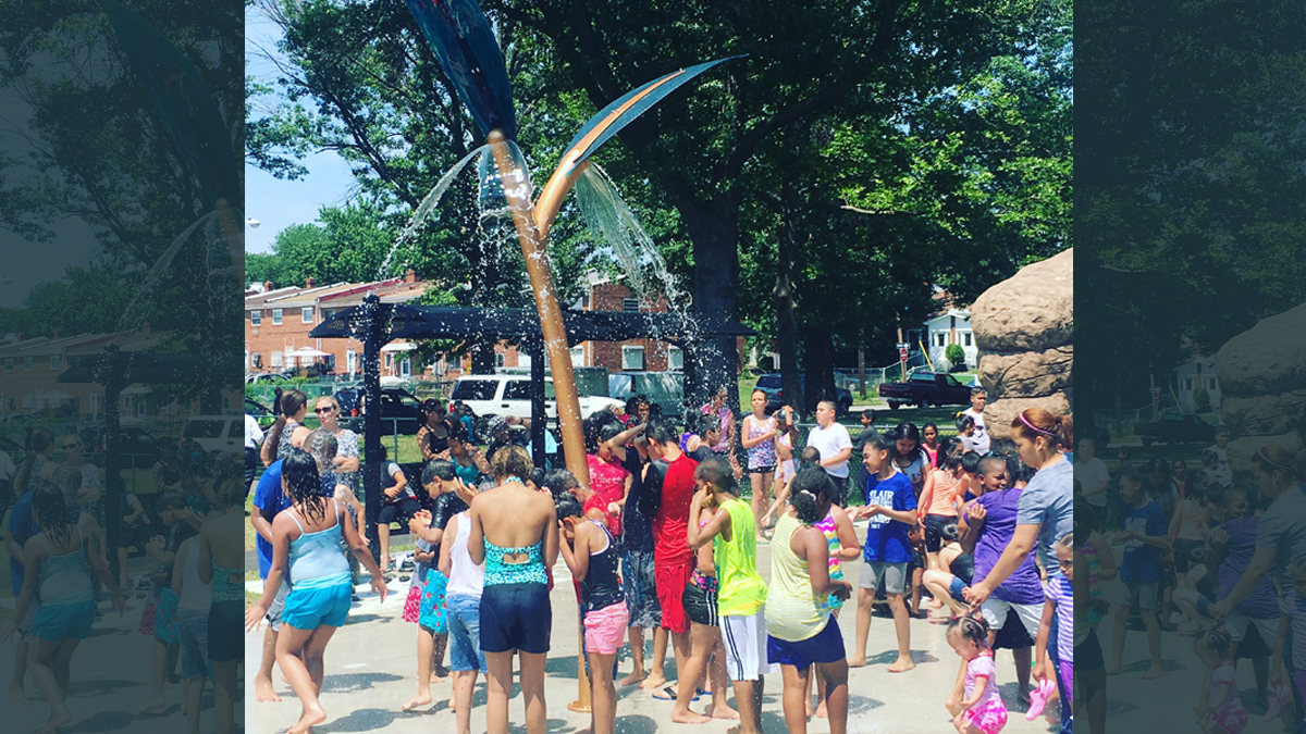 The newly opened Von Nieda Park Sprayground, the first of its kind located in Camden’s Cramer Hill neighborhood, is nature-themed, featuring a showering tree branch, a rock archway with sprays, spray jets that pop up from the ground like buds, a rain garden that captures, infiltrates and treats the sprayground’s water, and educational signage. (Photo provided) 
