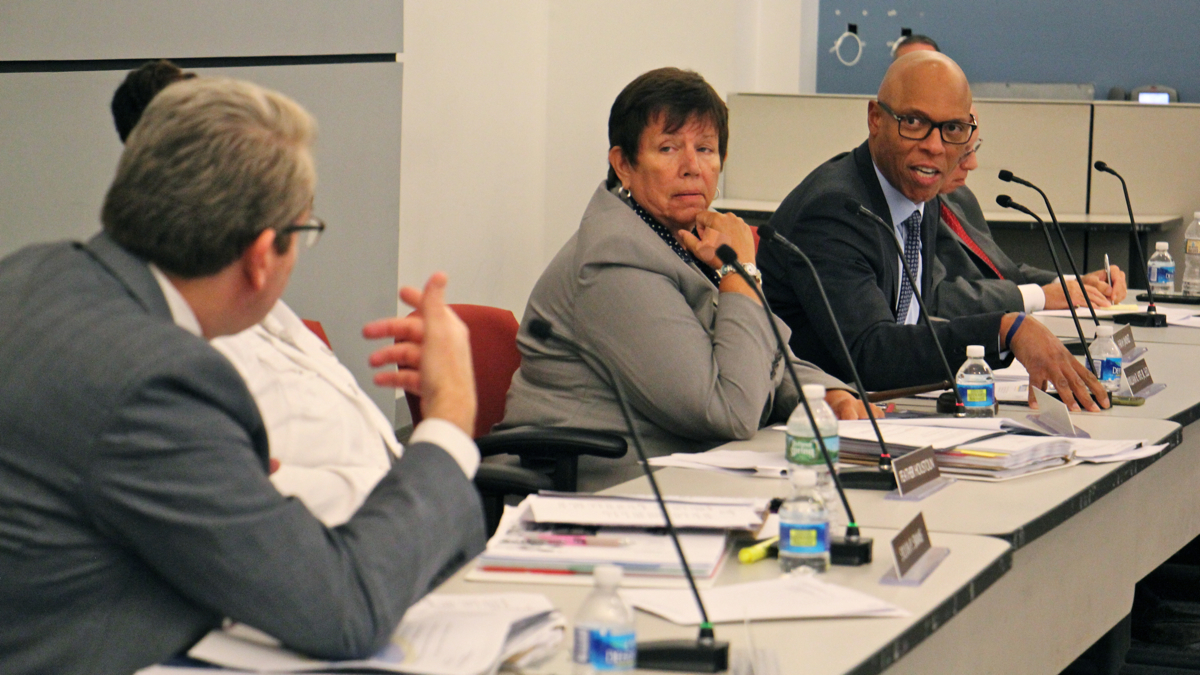 School Reform Commission member Bill Green (left) and Philadelphia schools Superintendent William Hite (right) exchange words during a board meeting Thursday. (Emma Lee/WHYY)