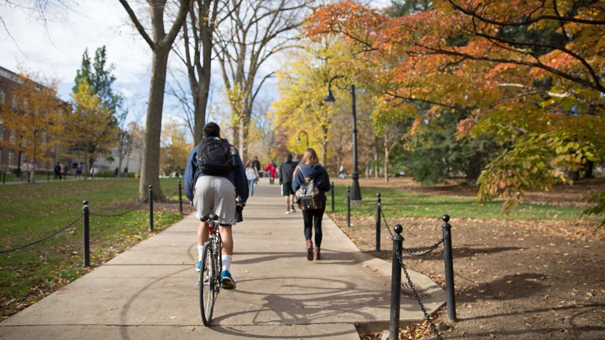 Students enter Penn State campus near Old Main Lawn and College Avenue. (Lindsay Lazarski/WHYY)