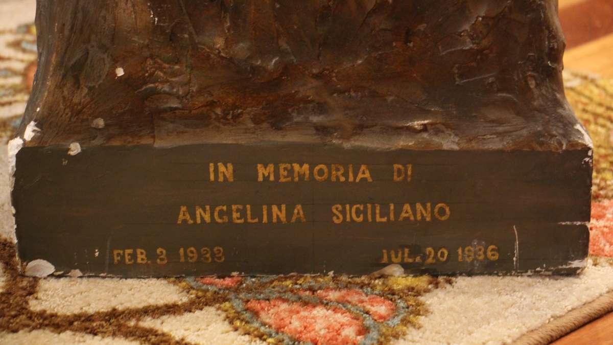 The signature and date at the base of the sculpture leads to the conclusion that it was made by Charles Pizzano, a sculptor from Medford, Massachusetts. (Emma Lee/WHYY)