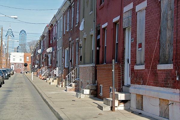 <p>This boarded up home at 1447 Bancroft Street interrupts a row of immaculately maintained houses. Investigators say it was stolen. (Emma Lee/for NewsWorks)</p>
