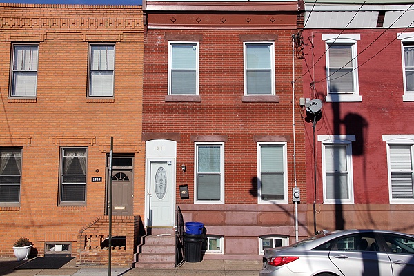 <p>Investigators say this home on Dickinson Street was stolen when it was uninhabited. (Emma Lee/for NewsWorks)</p>

