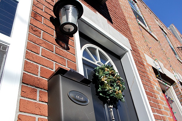 <p>An outgoing letter in the mailbox and a Christmas wreath indicate that this home on Kimball Street is currently occupied.  Investigators say it was stolen. (Emma Lee/for NewsWorks)</p>
