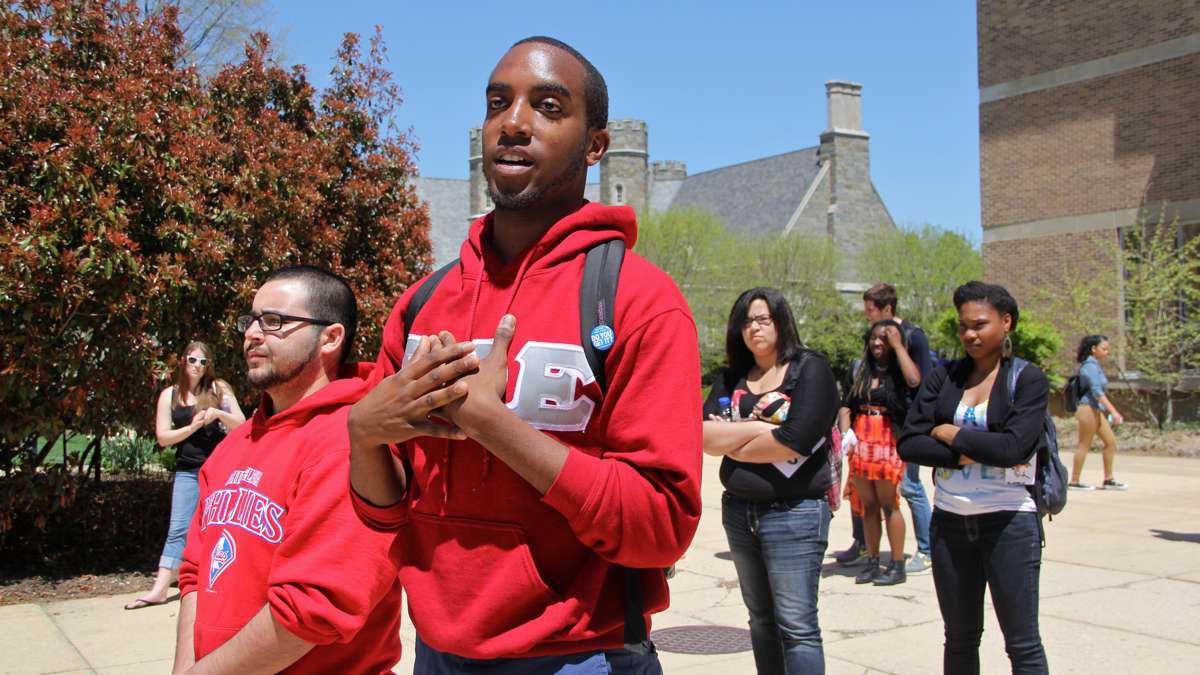 West Chester senior Malik Muhamad speaks on behalf of Men in Action, a campus group started two years ago to fight sexual and gender-based violence. (Emma Lee/for NewsWorks)