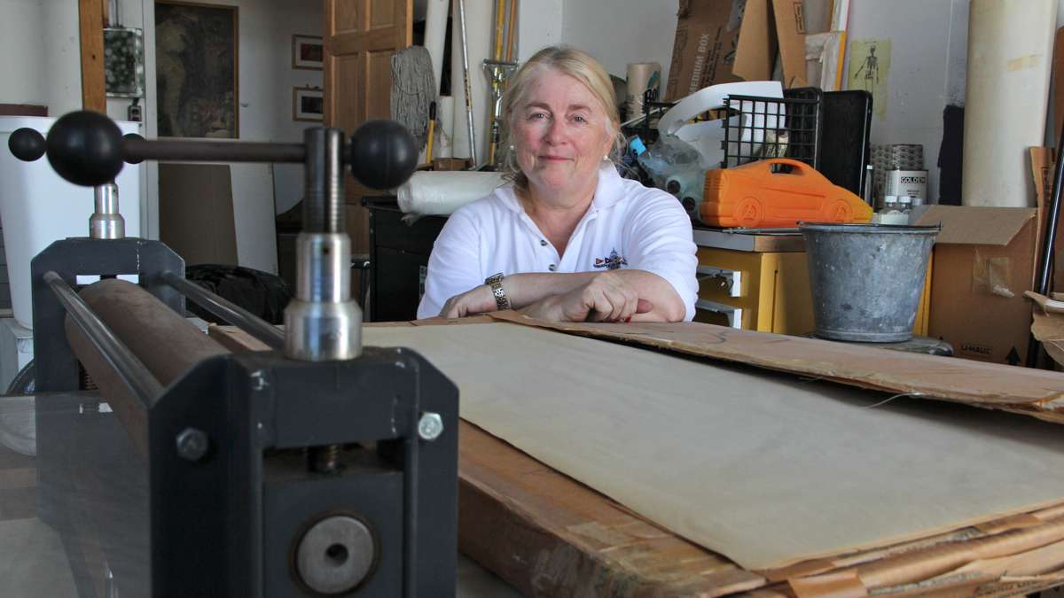 Printmaker Connie Cone contemplates what to remove from her fourth floor studio, which she has occupied since 2002. (Emma Lee/WHYY)