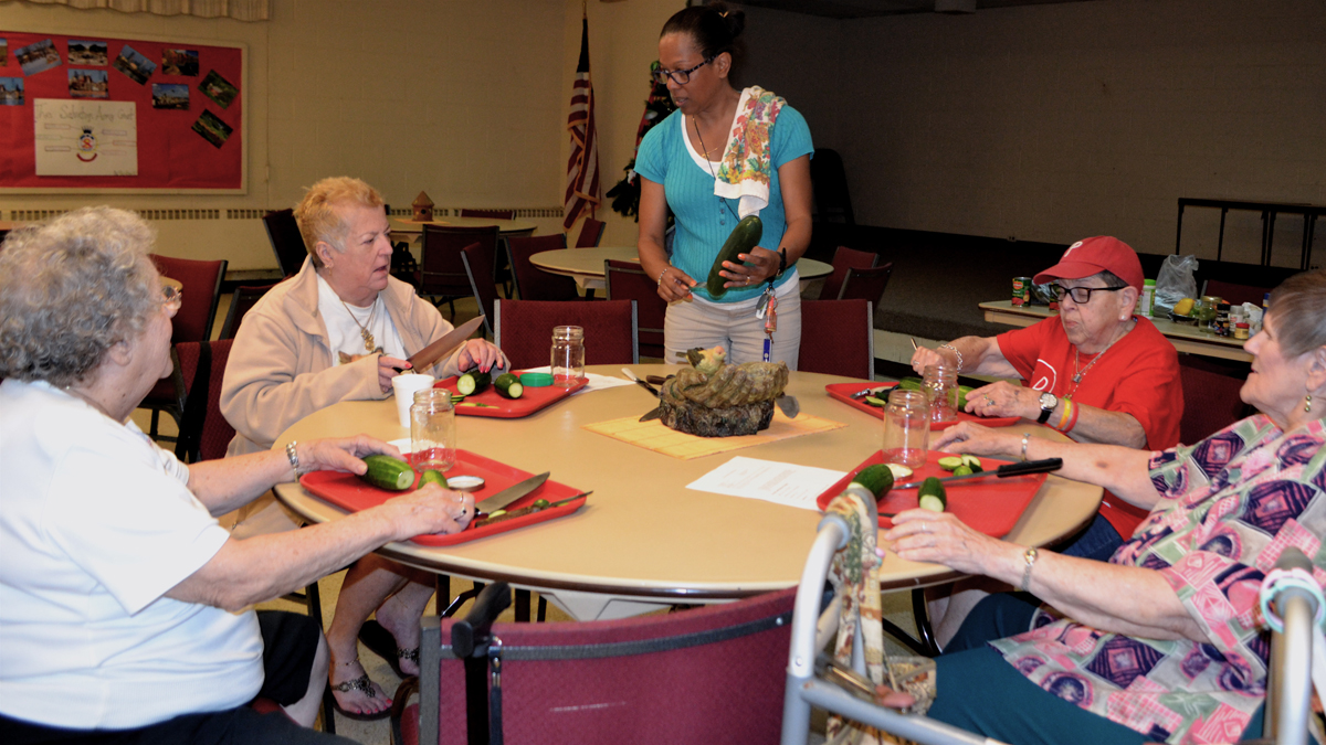  Marci Cooper, center, gives instructions on pickling to a group of senior day campers at The Salvation Army’s Roxborough Corps Community Center. Check back this week to learn what's in store for camp later this month. (Joel Frady/for NewsWorks) 