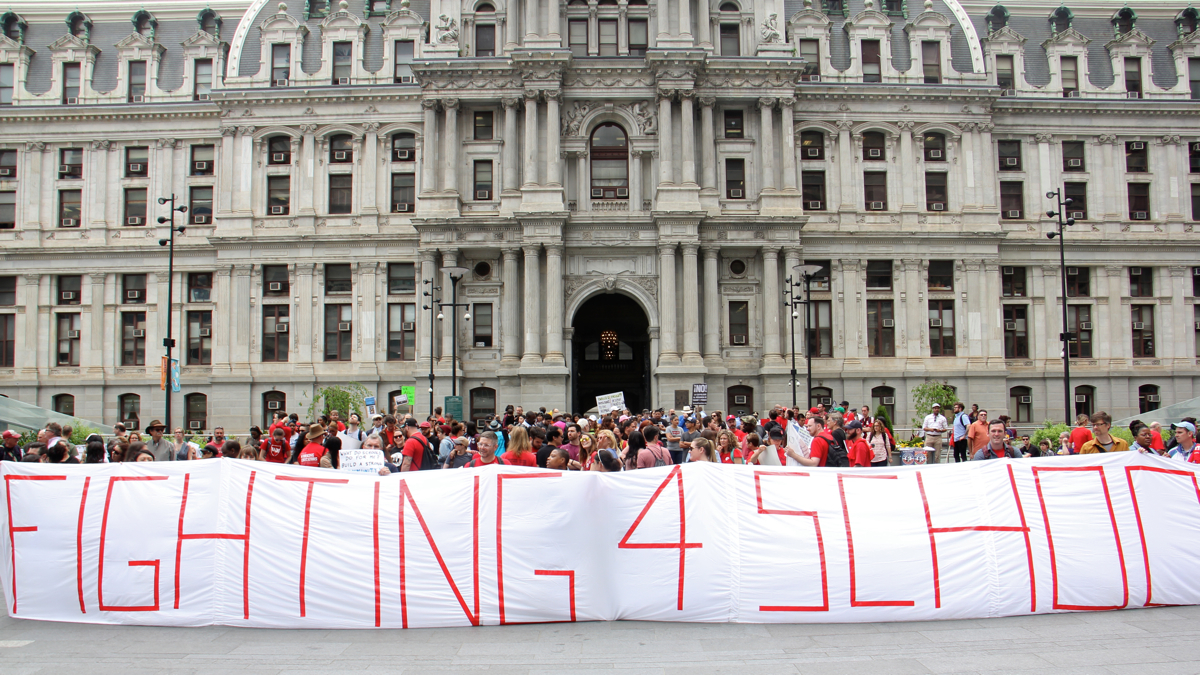  Philadelphia teachers protest outside City Hall on May 1, 2017. After 5 years without a contract, the teachers union and the Philadelphia school district have reached a tentative agreement. (Emma Lee/WHYY) 