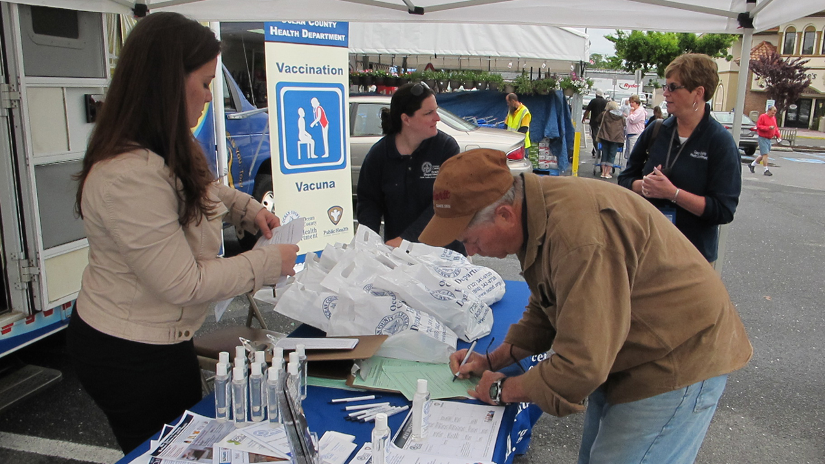  Residents in Point Pleasant Beach sign up to get free tetanus booster shot being offered by Ocean County Health Department at its mobile outreach van (Phil Gregory/for NewsWorks) 